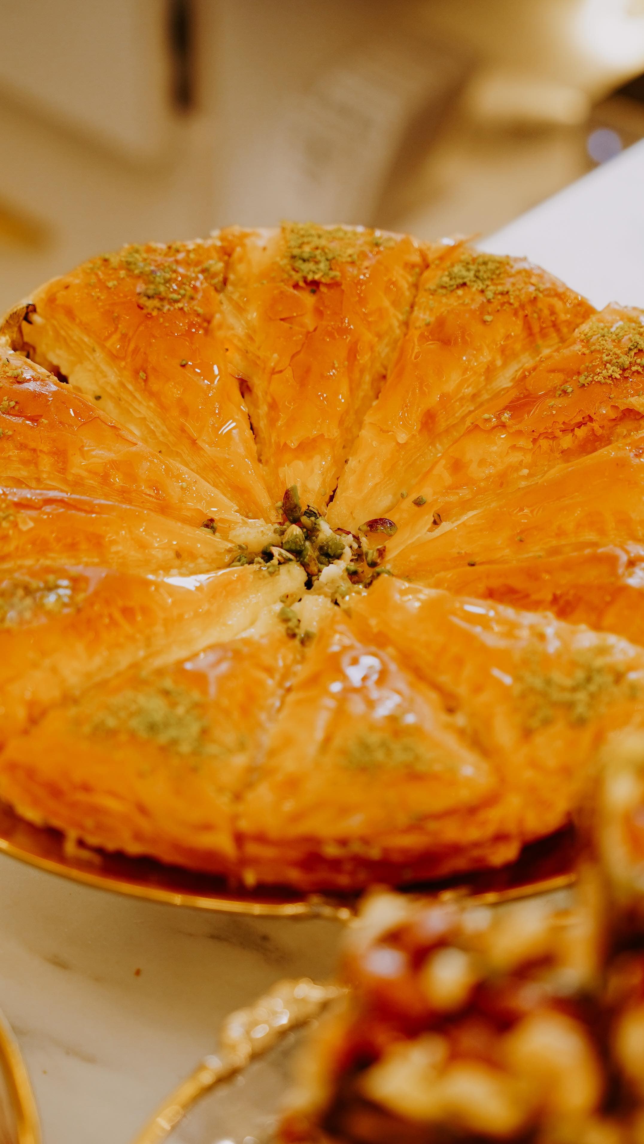 Pistachio baklava in a brass tray